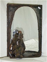 Spiegel met keramieken clown gedecoreerd met textielverharder- en bronstechniek